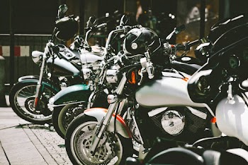 Photo of Motorcycles Parked on Pavement