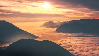 photo of mountain at sunset