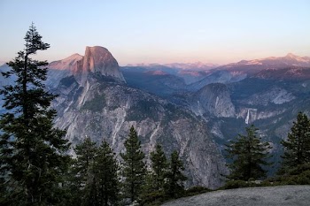 photo of mountain range under clear sky