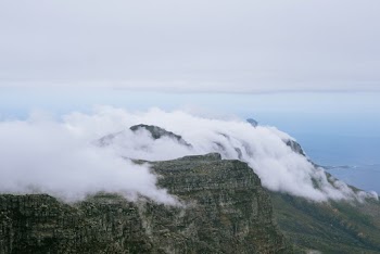 Photo Of Mountains Under Clouds 