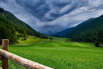 Photo Of Mountains Under Cloudy Sky