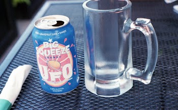 Photo of Mug Near Drink Can