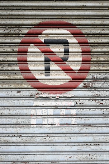 Photo of No Parking Sign on Roller Shutter