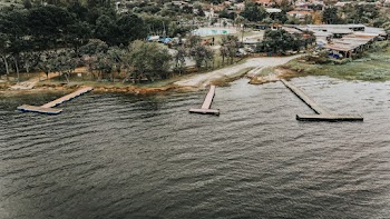 Photo of Ocean and Brown Wooden Decks 