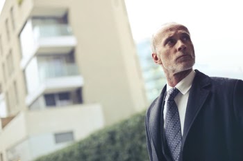 Photo of Old Man Wearing Formal Coat