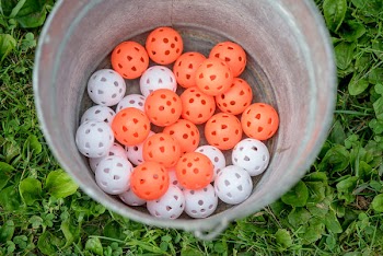 Photo of Orange and White Plastic Balls