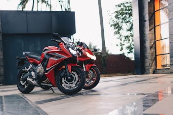 Photo of Parked Red and Black Sport Bikes