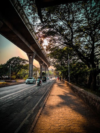 Photo Of Pavement Beside Bridge During Daytime