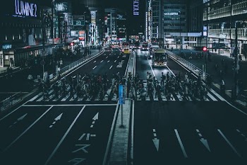 photo of pedestrian during nighttime