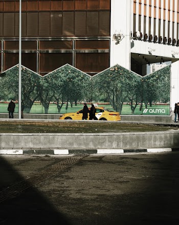 Photo Of People Beside Yellow Taxi