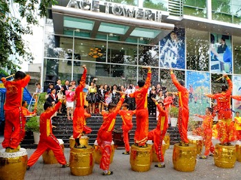 Photo Of People Celebrating In Front Of The Buidling