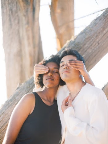 Photo Of People Covering Each Other's Eyes