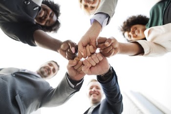 Photo of People Doing Fist Bump