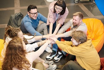Photo Of People Holding Each Other's Hands