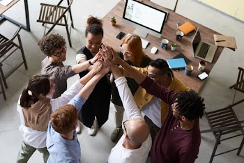 Photo Of People Holding Each Other's Hands 