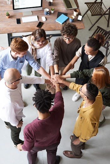 Photo Of People Holding Each Other's Hands · Free Stock Photo