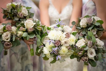 Photo of People Holding Flowers