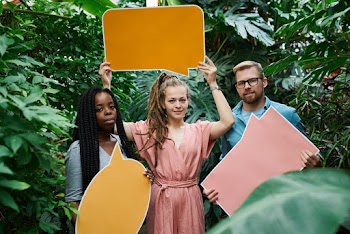 Photo Of People Holding Sign Board