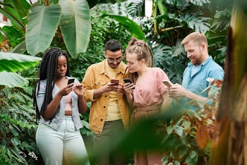 Photo Of People holding Their Phones