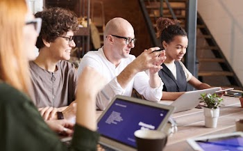 Photo Of People Looking On Laptop