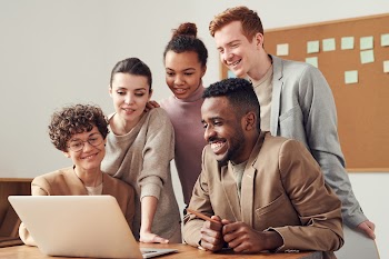 Photo Of People Looking On Laptop · Free Stock Photo