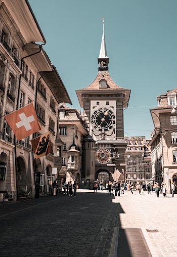 Photo of People Near Clock Tower During Daytime