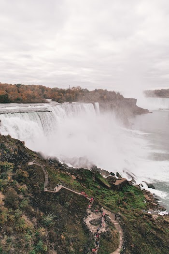 Photo of People Near Waterfall