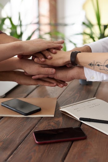Photo Of People Near Wooden Table · Free Stock Photo
