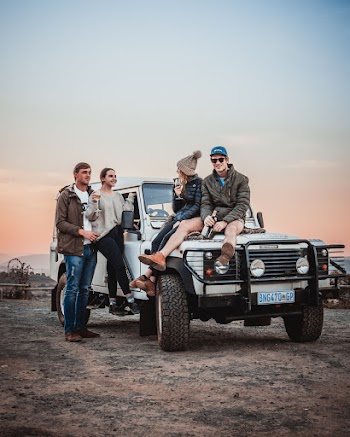Photo Of People On A White SUV
