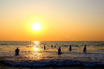 Photo of People On Beach During Sunset