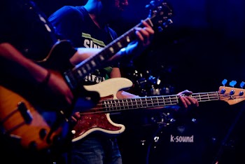 Photo of People Playing Electric Guitars