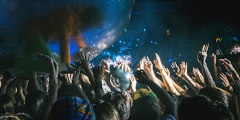 Photo of People Raising Their Hands