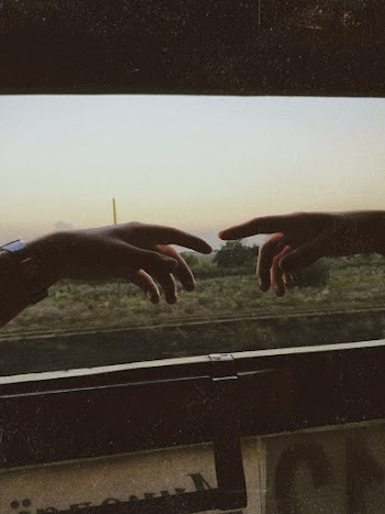 Photo Of People Reaching Each Other