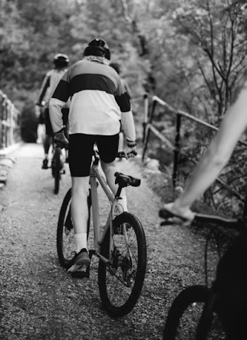 Photo of People Riding Bicycle