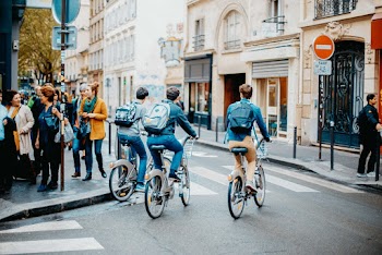 Photo of People Riding Bicycle on Street
