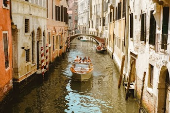 Photo Of People Riding Boat During Daytime