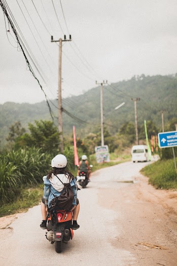 Photo of People Riding Motorcycle