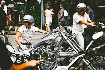 Photo of People Riding Motorcycle
