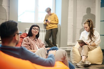 Photo Of People Sitting Near Each Other