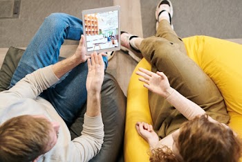 Photo Of People Sitting On Bean Bag Chairs