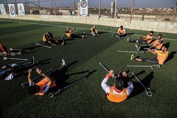 Photo of People Sitting on Green Grass Field
