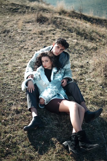Photo Of People Sitting On Ground