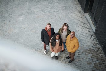 Photo Of People Standing Beside Each Other