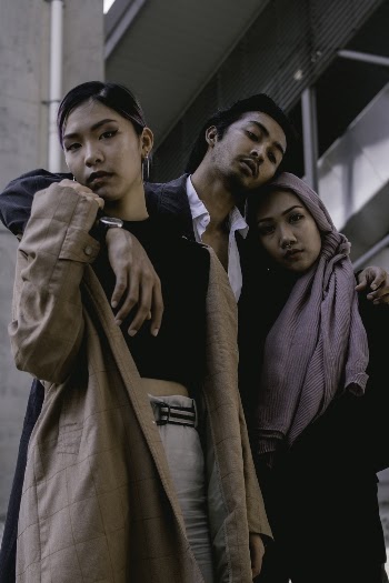 Photo of People Standing Close To Each Other