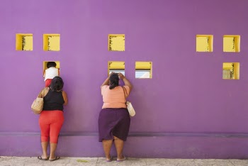 Photo of People Standing in Front of Wall