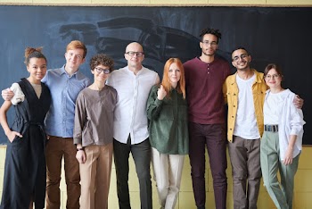 Photo Of People Standing Near Blackboard
