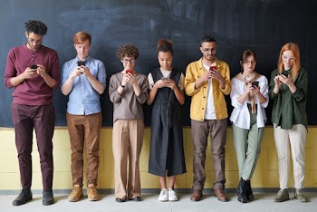 Photo Of People Standing Near Blackboard