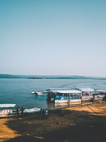Photo of People Standing Near Boats