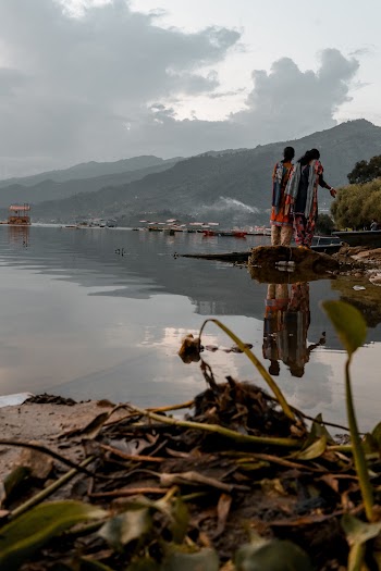 Photo Of People Standing Near River