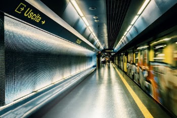 Photo of People Standing Near Train